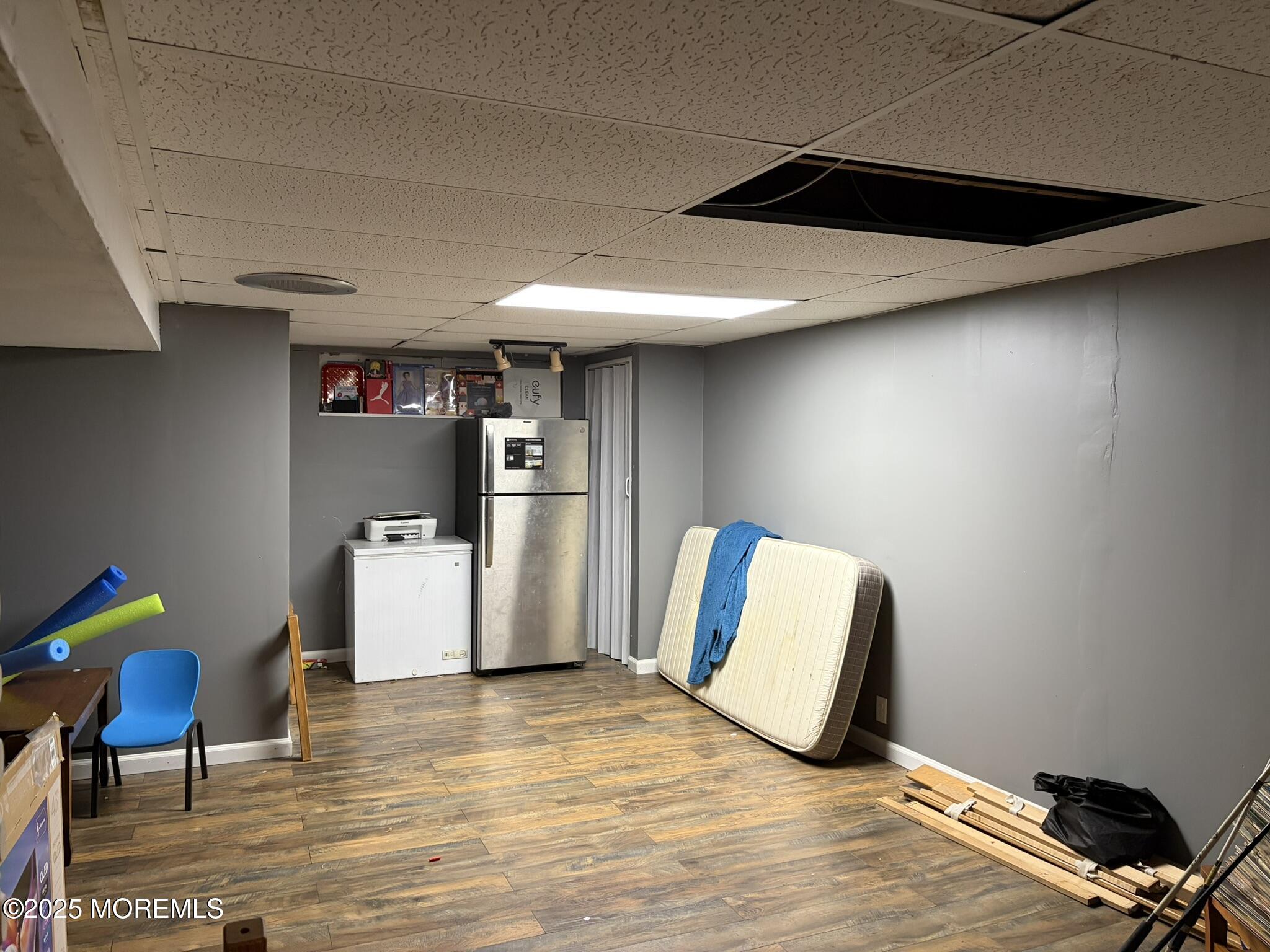 11 Chestnut Ridge Road Holmdel, NJ 07733 - Photo 40 of 44 a room with furniture and a wooden floor