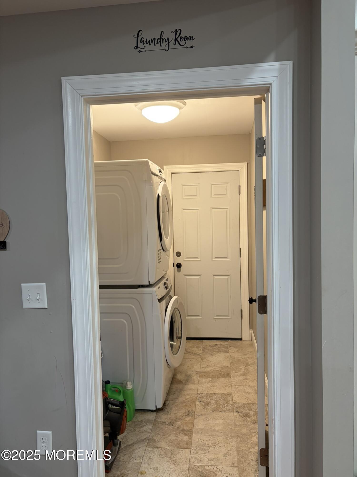 11 Chestnut Ridge Road Holmdel, NJ 07733 - Photo 42 of 44 a view of a storage & utility room with a washer dryer