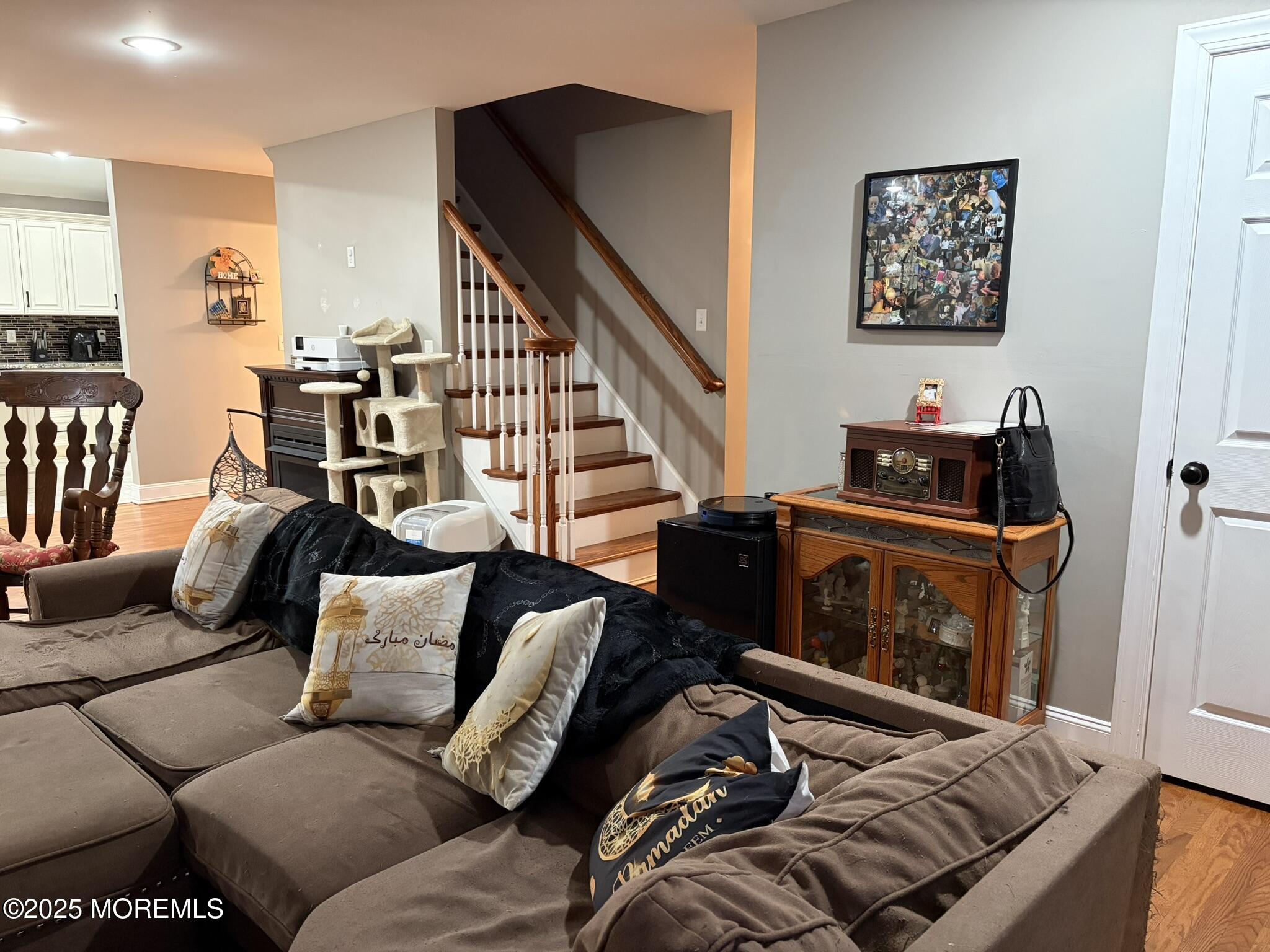 11 Chestnut Ridge Road Holmdel, NJ 07733 - Photo 8 of 44 a living room with furniture and stairs