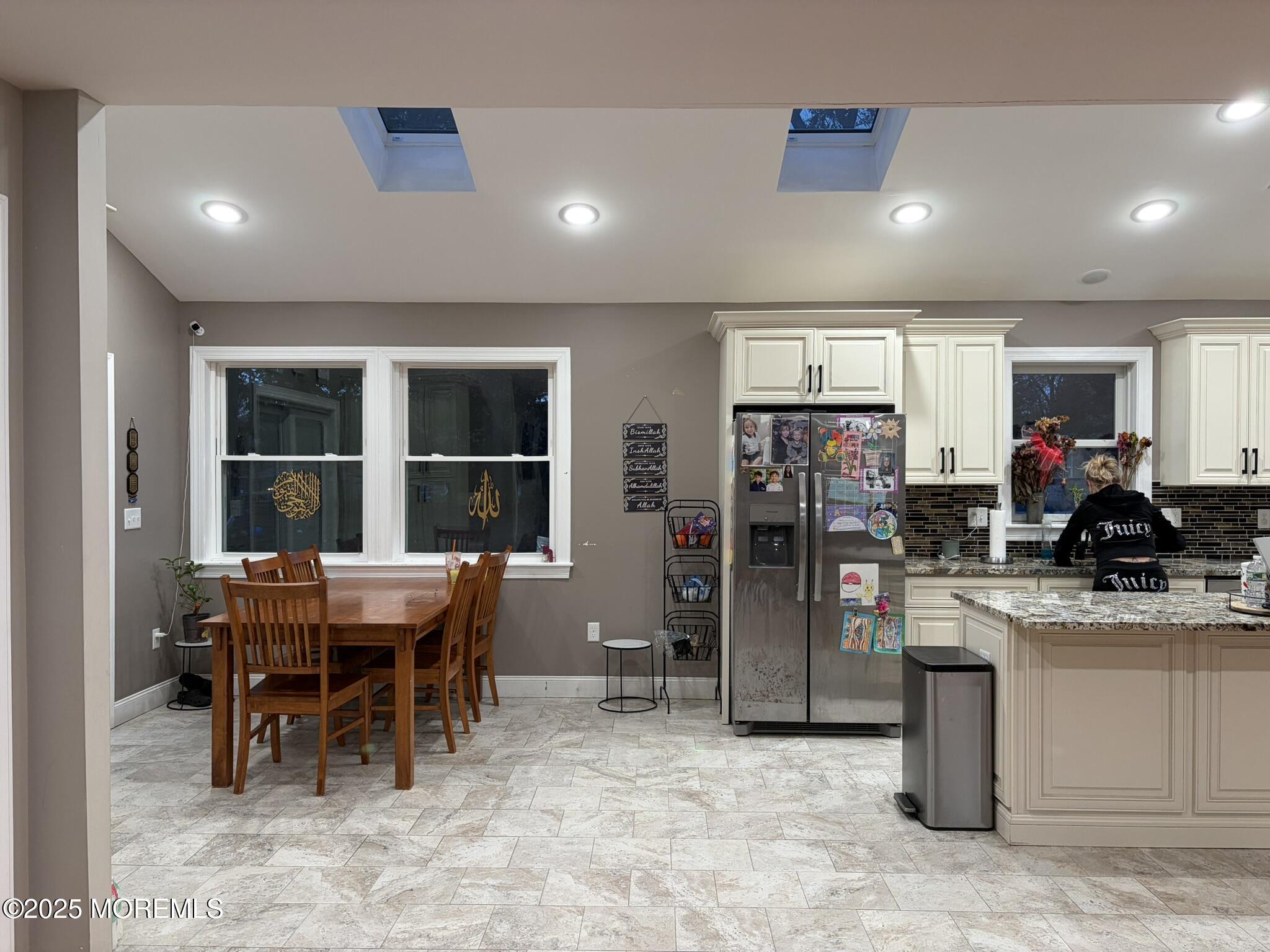 11 Chestnut Ridge Road Holmdel, NJ 07733 - Photo 9 of 44 a kitchen with stainless steel appliances kitchen island granite countertop a refrigerator and a sink