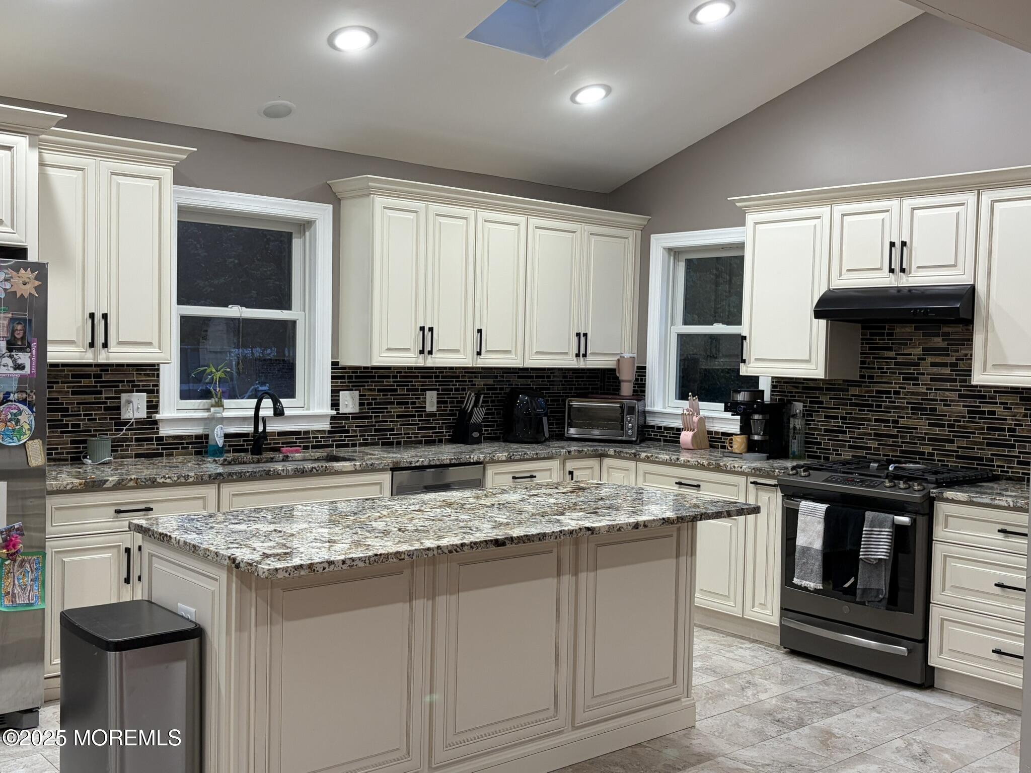 11 Chestnut Ridge Road Holmdel, NJ 07733 - Photo 10 of 44 a kitchen with stainless steel appliances granite countertop a stove sink and cabinets