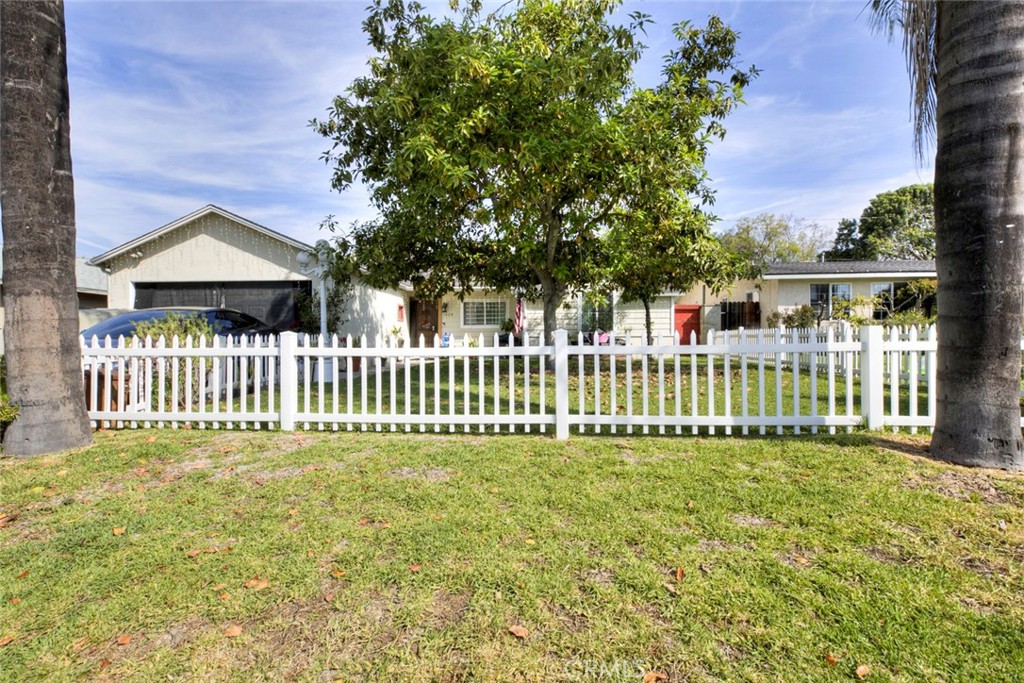 1029 East Galatea Street Azusa, CA 91702 - Photo 1 of 36 a white house with a small yard and plants