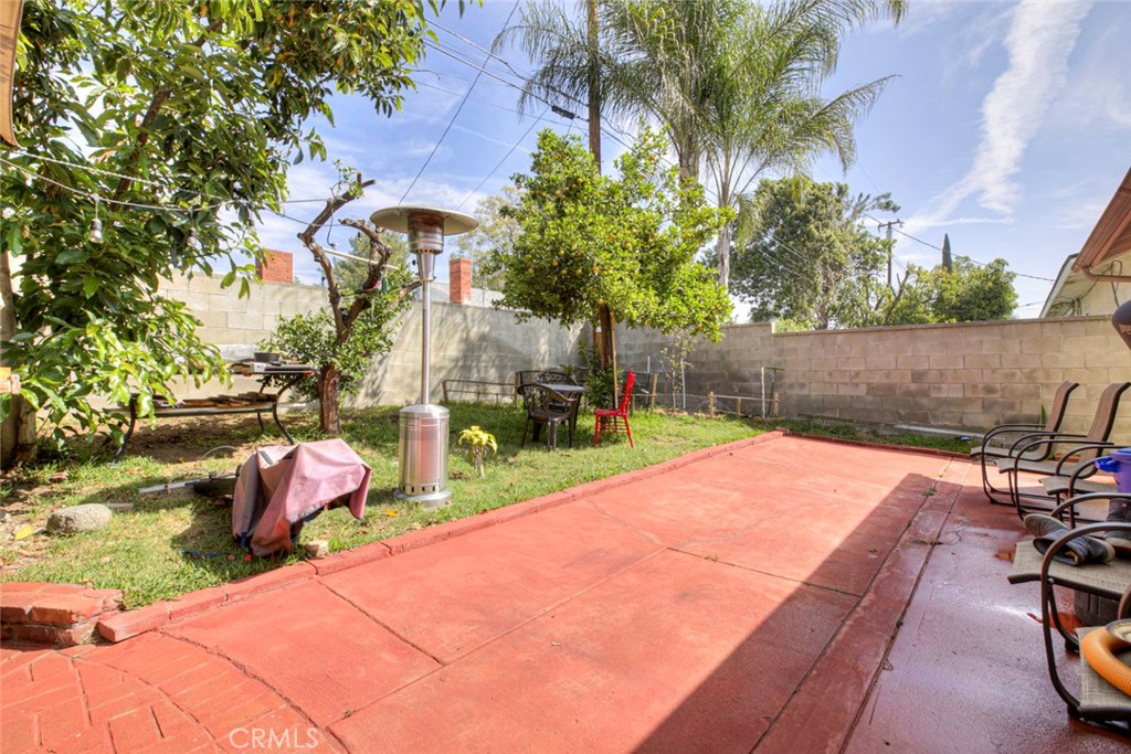 1029 East Galatea Street Azusa, CA 91702 - Photo 11 of 36 a backyard of a house with table and chairs