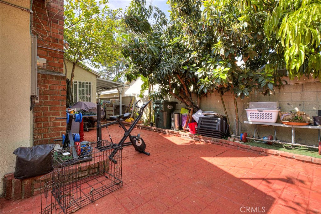 1029 East Galatea Street Azusa, CA 91702 - Photo 15 of 36 a view of a room with gym equipment and a tree