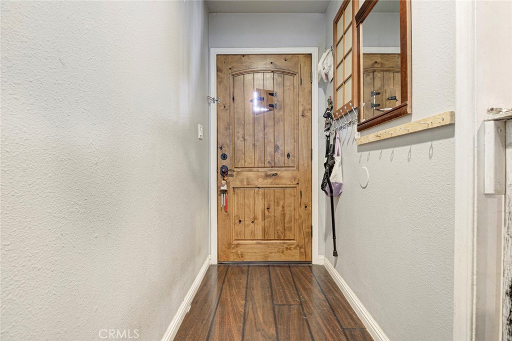 1029 East Galatea Street Azusa, CA 91702 - Photo 17 of 36 a view of a hallway with wooden floor and entryway