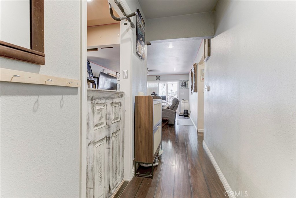 1029 East Galatea Street Azusa, CA 91702 - Photo 18 of 36 a view of a hallway with wooden floor and cabinets