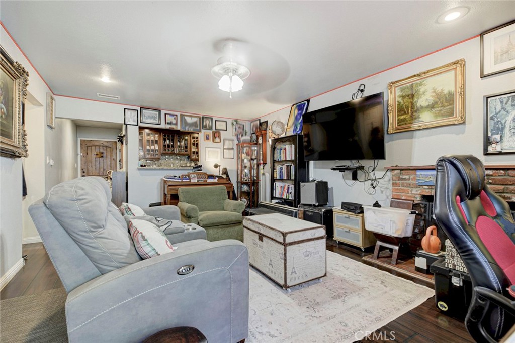 1029 East Galatea Street Azusa, CA 91702 - Photo 25 of 36 a living room with furniture and a flat screen tv