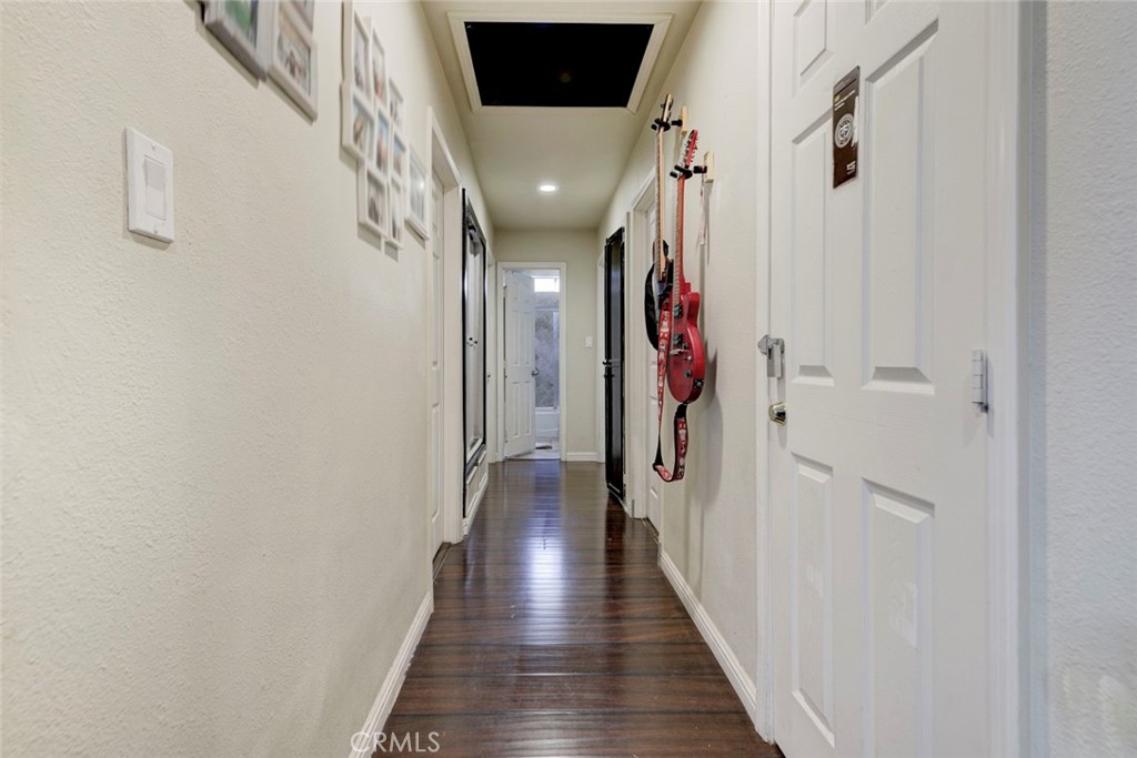 1029 East Galatea Street Azusa, CA 91702 - Photo 26 of 36 a view of a hallway with wooden floor and entryway