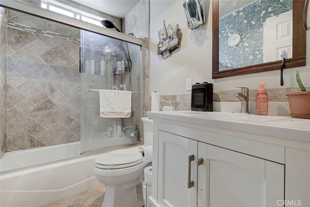 1029 East Galatea Street Azusa, CA 91702 - Photo 27 of 36 a bathroom with a toilet sink and mirror