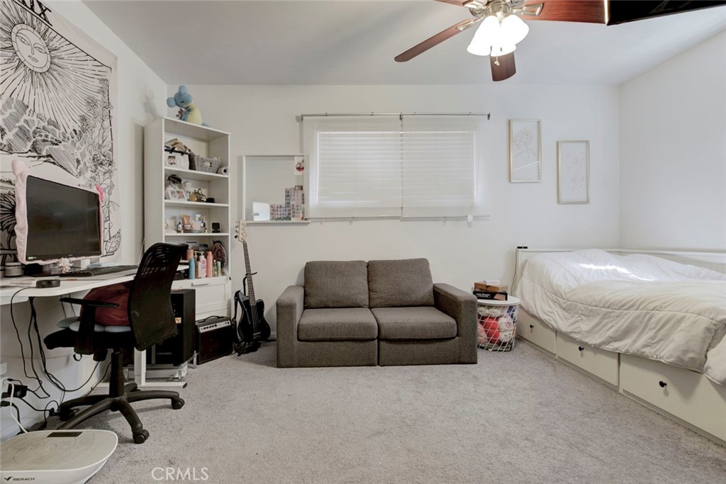 1029 East Galatea Street Azusa, CA 91702 - Photo 28 of 36 a bedroom with furniture and a flat screen tv
