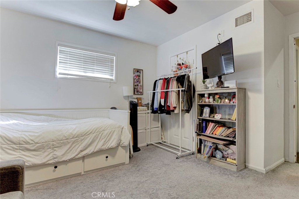 1029 East Galatea Street Azusa, CA 91702 - Photo 29 of 36 a bedroom with furniture and a flat screen tv