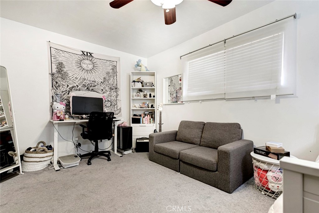 1029 East Galatea Street Azusa, CA 91702 - Photo 30 of 36 a living room with furniture and a fireplace