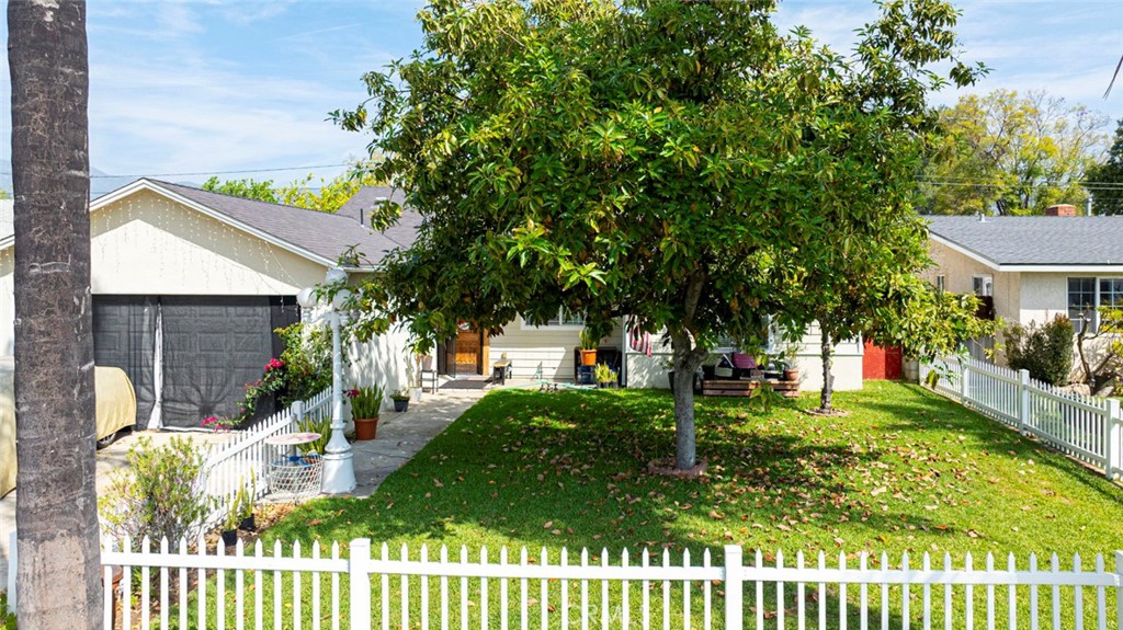 1029 East Galatea Street Azusa, CA 91702 - Photo 35 of 36 a front view of a house with garden
