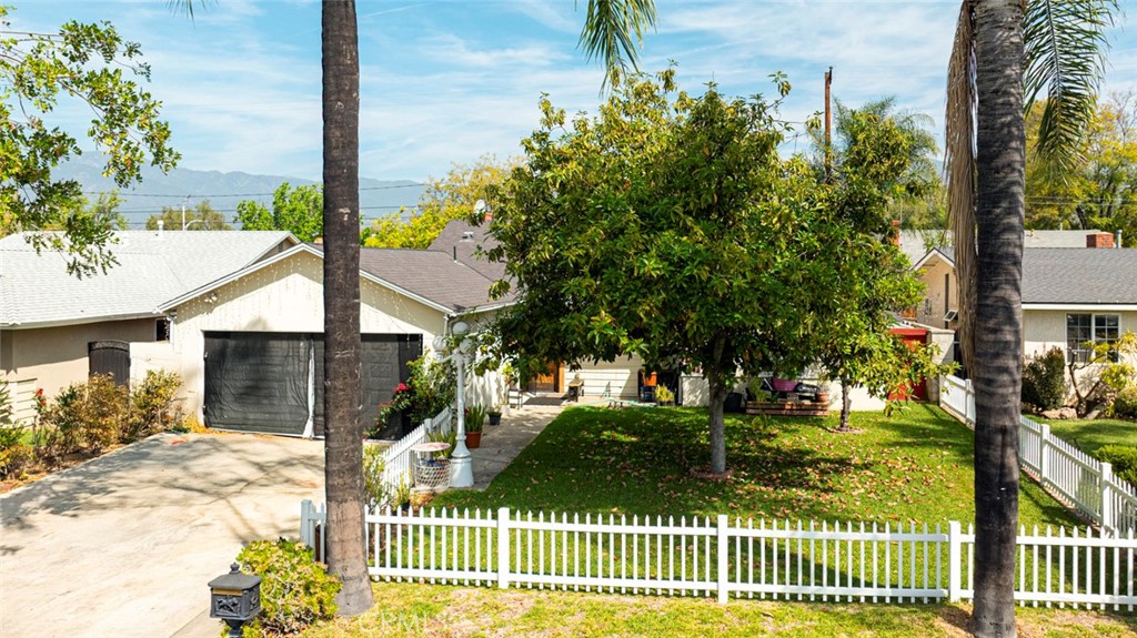 1029 East Galatea Street Azusa, CA 91702 - Photo 36 of 36 a view of a house with a yard and potted plants