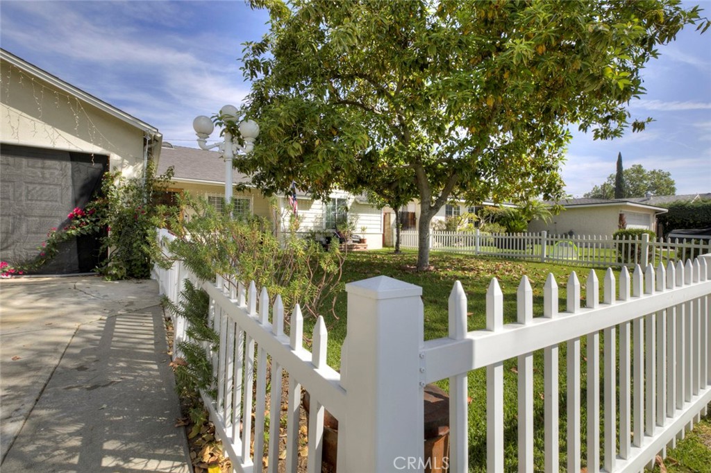1029 East Galatea Street Azusa, CA 91702 - Photo 7 of 36 a view of a house with a tree in front of it