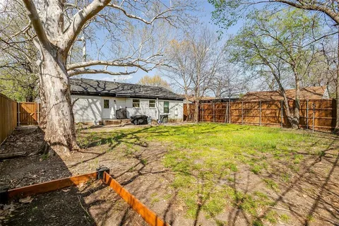 a backyard of a house with lots of green space