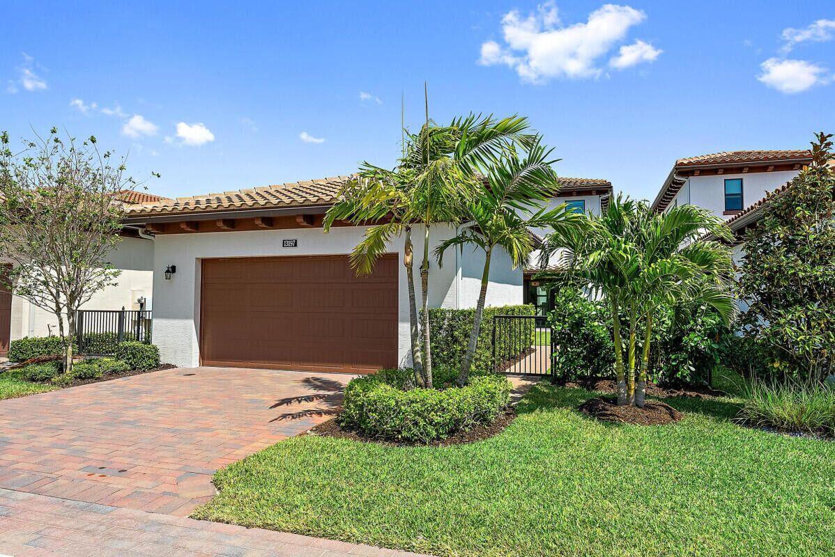 13197 Alton Road Palm Beach Gardens, FL 33418 - Photo 32 of 44 Garage driveway