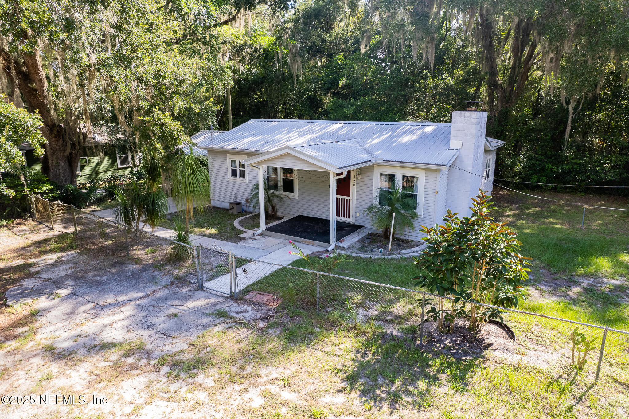 128 Devils Elbow Palatka, FL 32177 - Photo 1 of 38 a view of a house with a yard