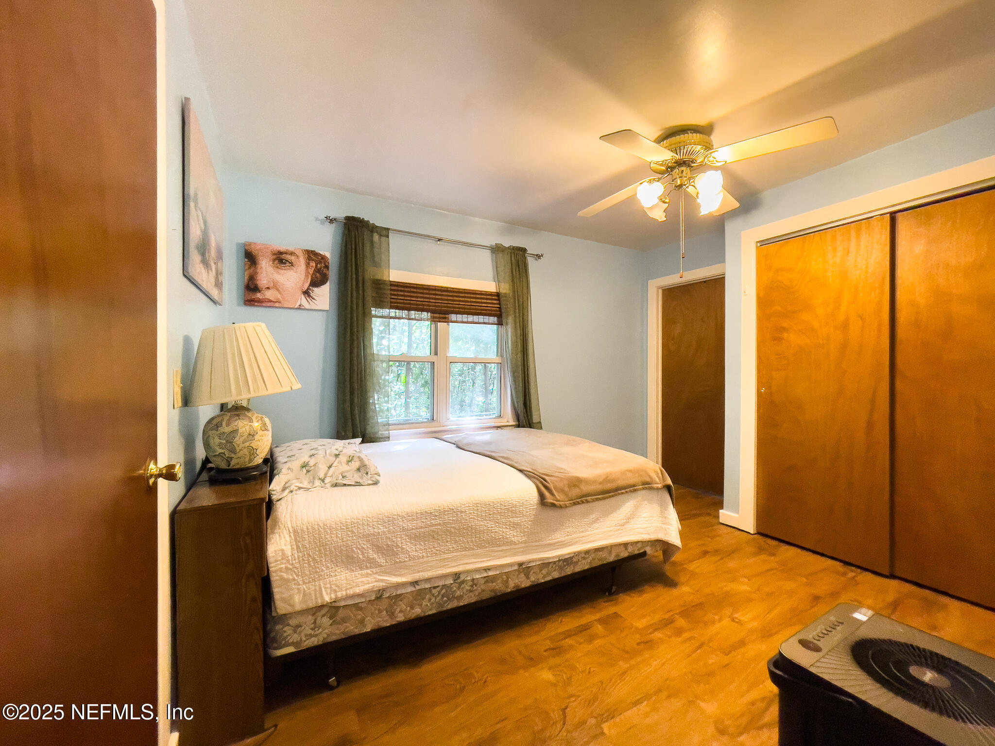 128 Devils Elbow Palatka, FL 32177 - Photo 12 of 38 a bedroom with a bed dresser and a window