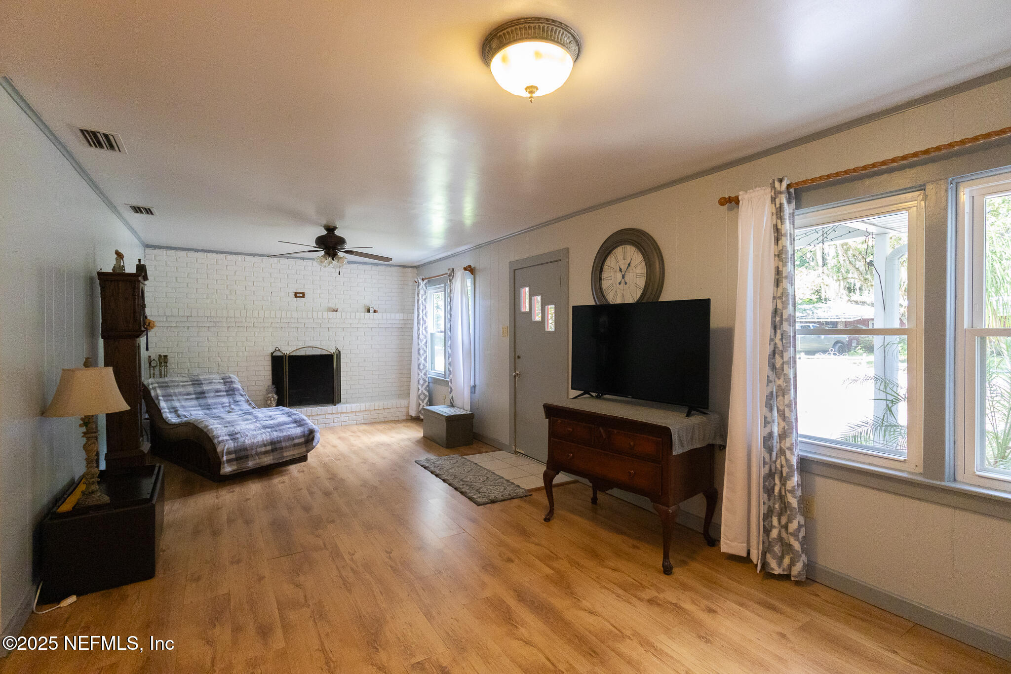 128 Devils Elbow Palatka, FL 32177 - Photo 3 of 38 a living room with furniture and a flat screen tv