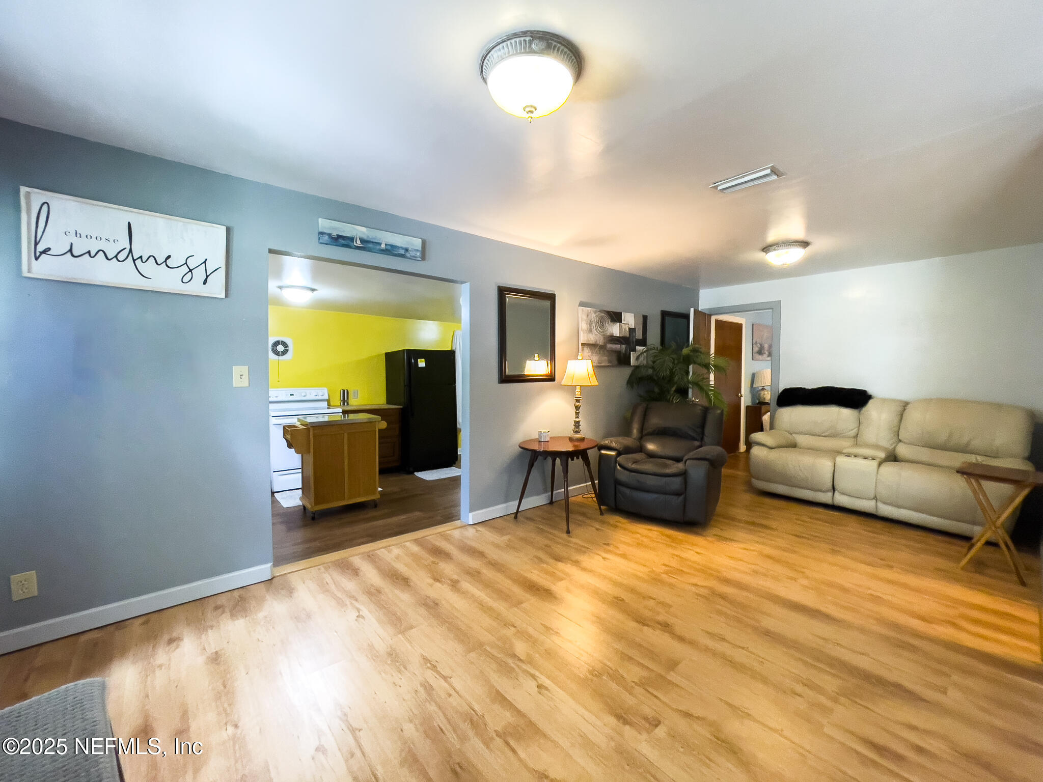 128 Devils Elbow Palatka, FL 32177 - Photo 6 of 38 a living room with furniture and a flat screen tv