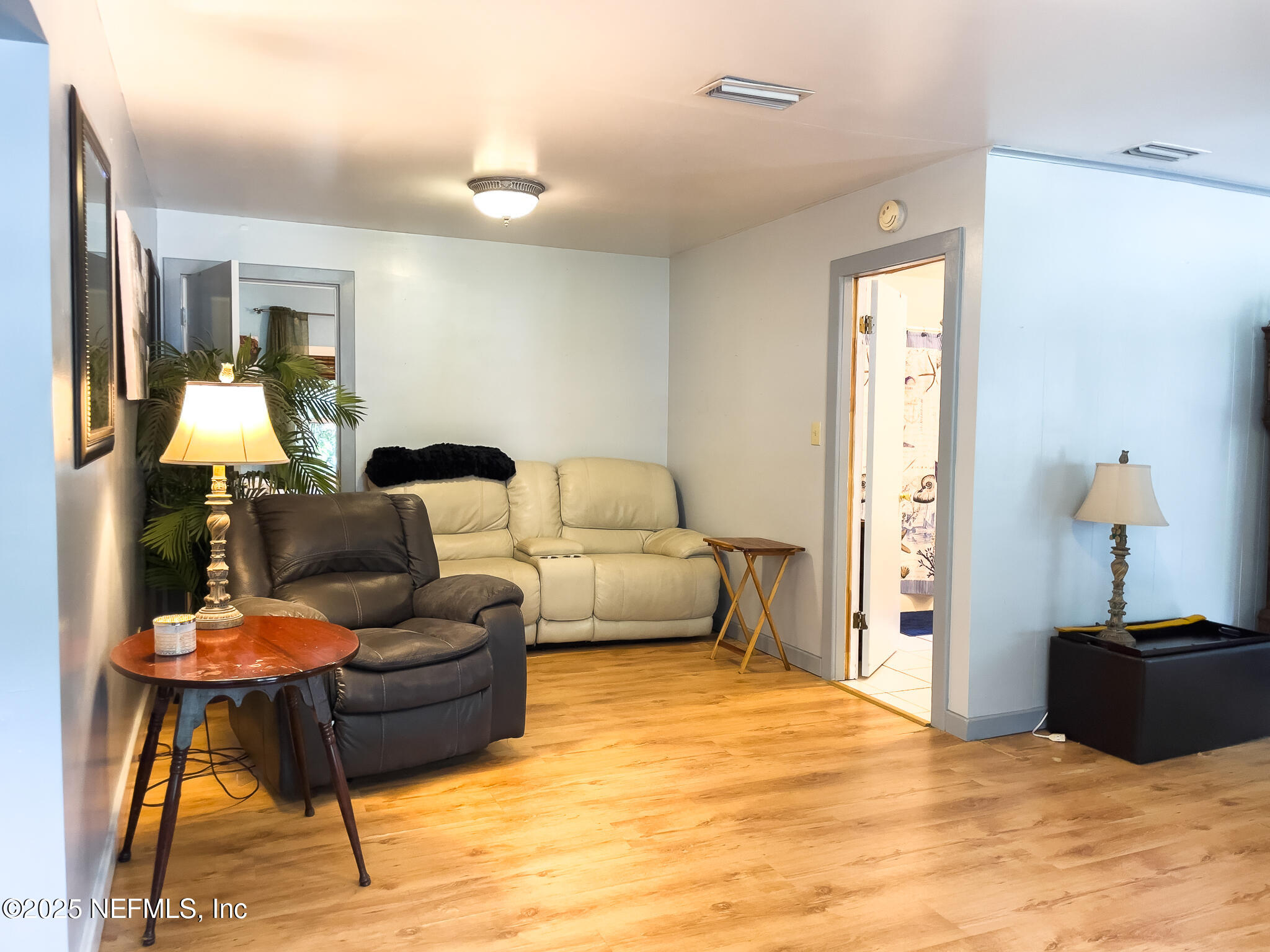 128 Devils Elbow Palatka, FL 32177 - Photo 8 of 38 a bedroom with furniture and a bed