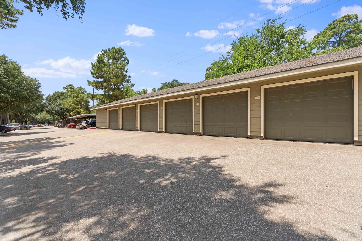 2400-1033 Spring Rain Drive Spring, TX 77379 - Photo 28 of 35 a front view of a house with a yard and garage