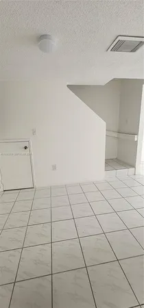 a view of a room with white walls