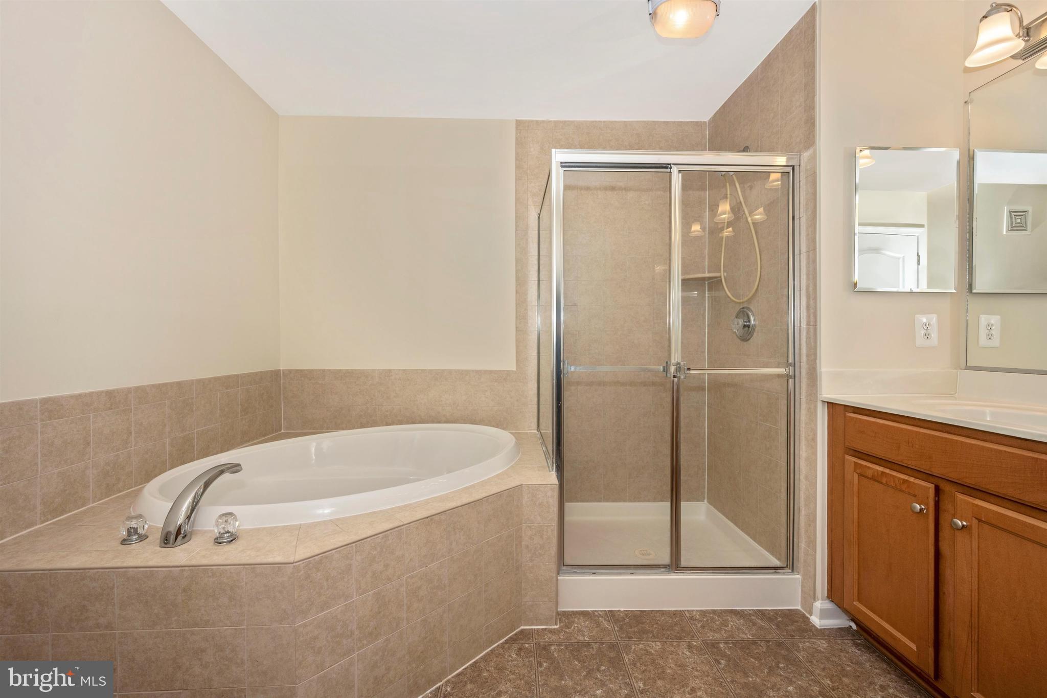 11525 Georgia Avenue Silver Spring, MD 20902 - Photo 35 of 44 MASTER BATH WITH SOAKING TUB AND SEPARATE SHOWER