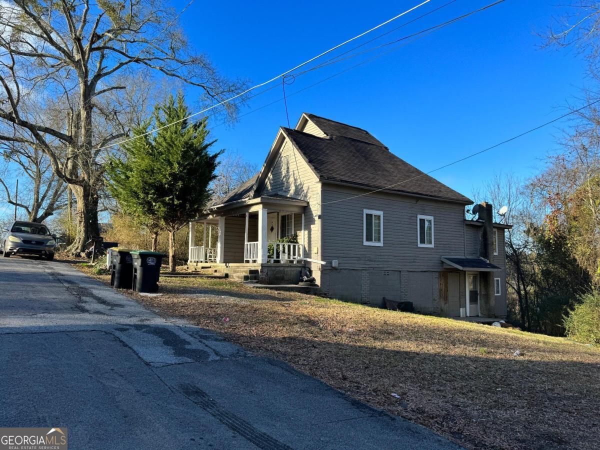 215 Smith Street Northeast Rome, GA 30161 - Photo 1 of 1 a view of a house with a yard