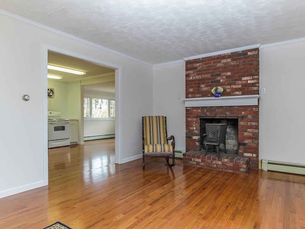 1991 Harpswell Islands Road Bailey Island, ME 04003 - Photo 5 of 16 The living room includes a fireplace...