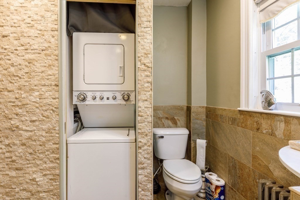 14 Baker Lane Templeton, MA 01468 - Photo 11 of 21 a white toilet sitting next to a bathroom sink