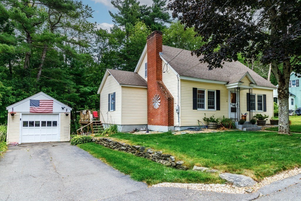 14 Baker Lane Templeton, MA 01468 - Photo 2 of 21 a front view of a house with a garden and yard