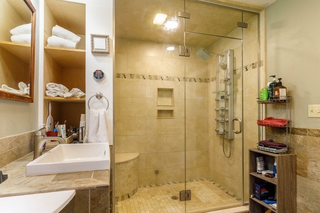 14 Baker Lane Templeton, MA 01468 - Photo 10 of 21 a bathroom with a granite countertop shower mirror and a sink