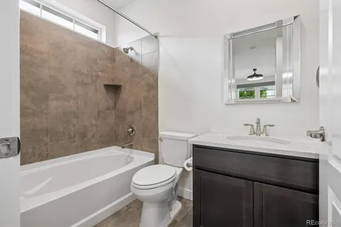 a kitchen with stainless steel appliances granite countertop sink stove top oven and cabinets