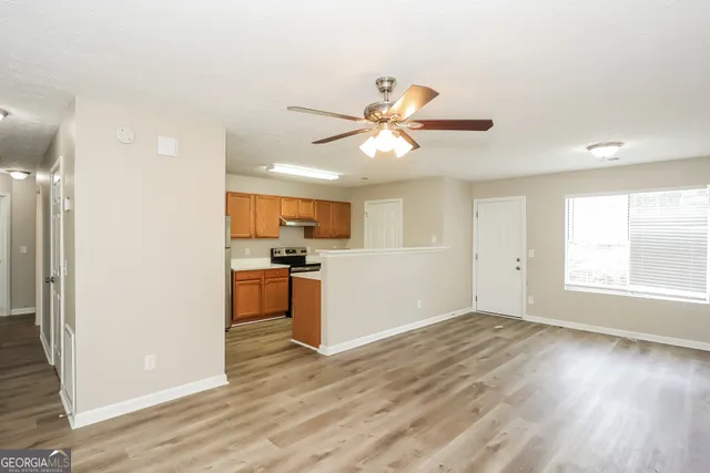 a view of a kitchen with a sink and a window