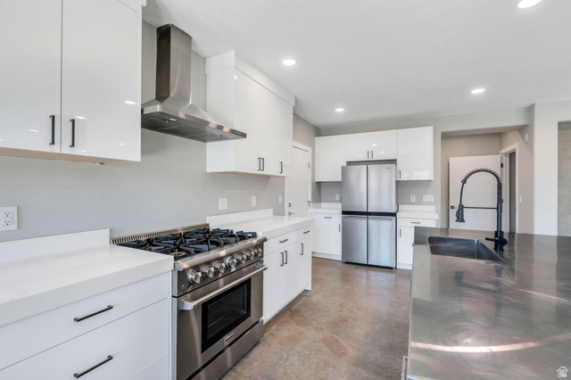 7045 South 300 East Midvale, UT 84047 - Photo 14 of 49 Contemporary kitchen featuring white cabinetry, stainless steel appliances, a large range with a professional hood, white countertops, and a black gooseneck faucet