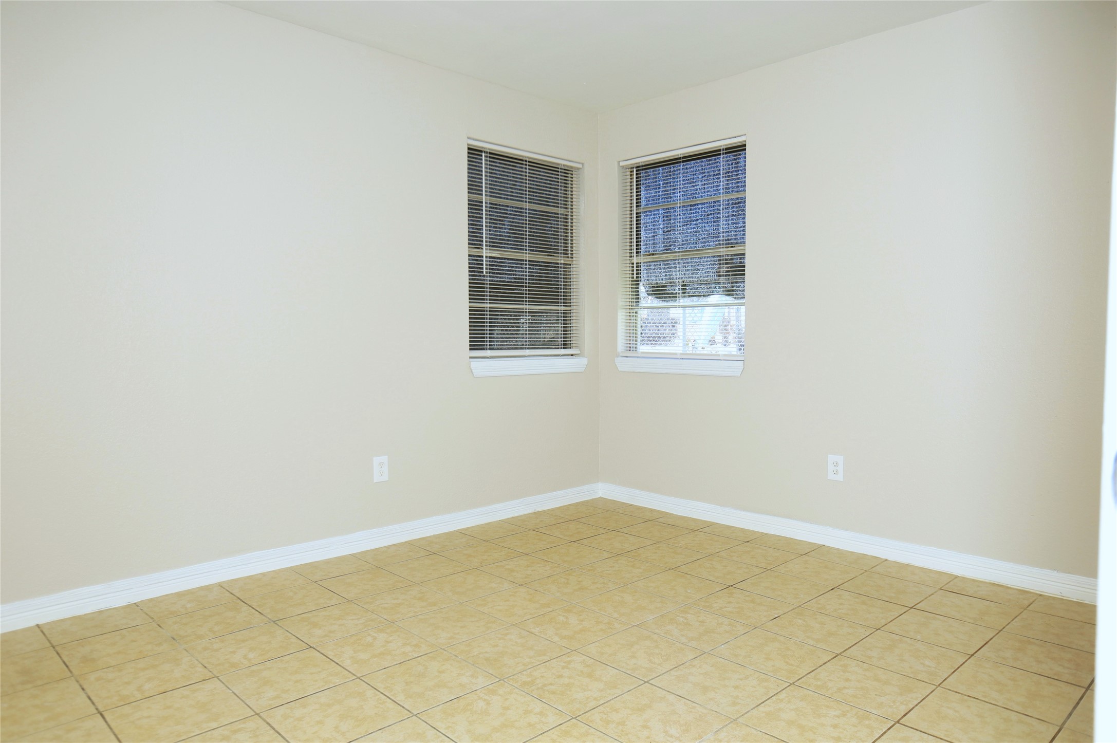 123 West 6th Street Freeport, TX 77541 - Photo 6 of 10 a view of an empty room with wooden floor and a window