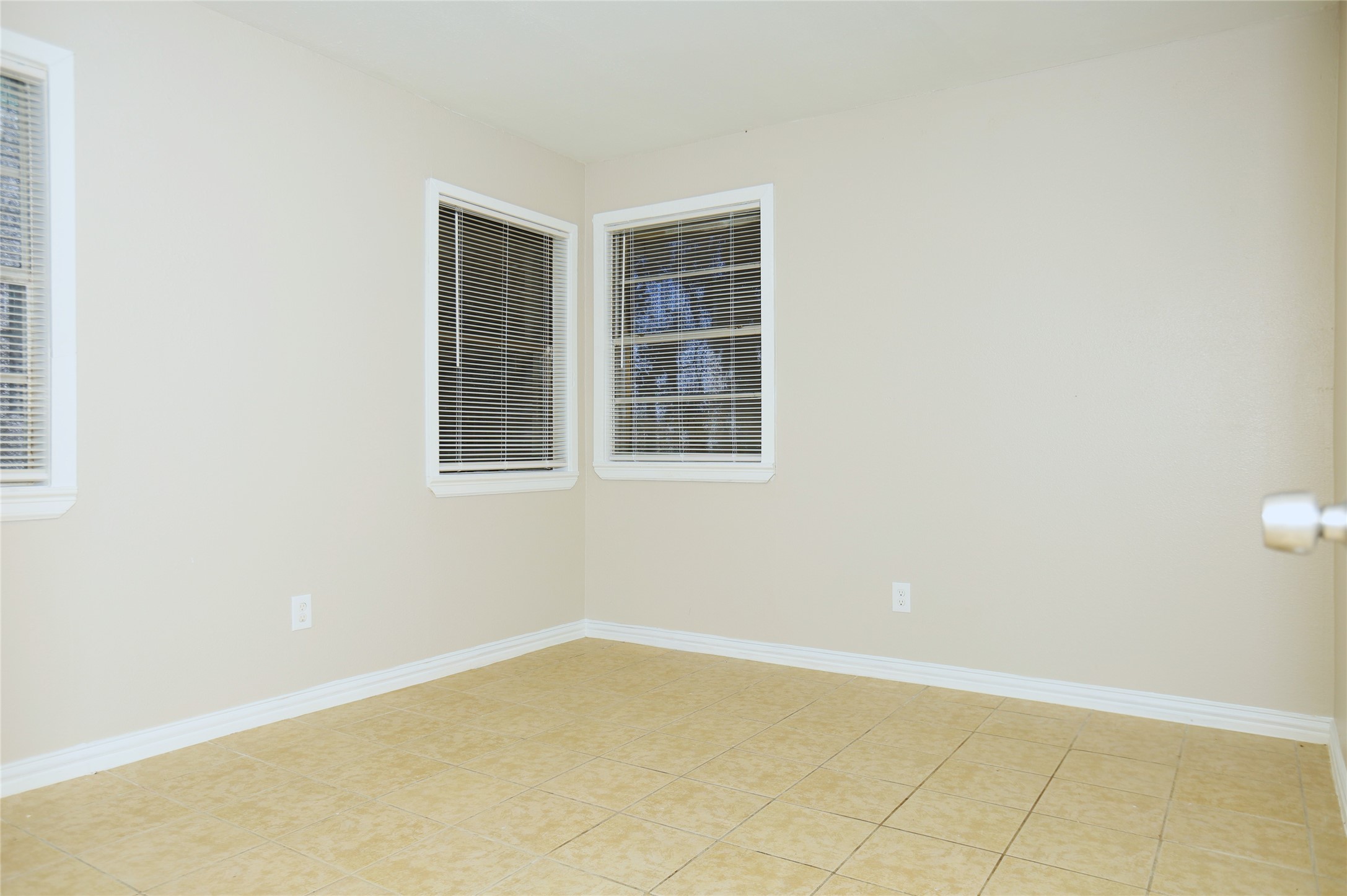 123 West 6th Street Freeport, TX 77541 - Photo 7 of 10 a view of an empty room with a window