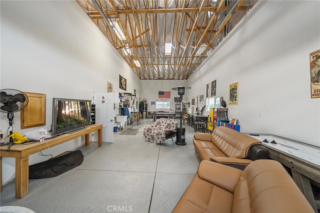 7172 Jargon Road Hesperia, CA 92344 - Photo 50 of 75 a living room with furniture and a chandelier