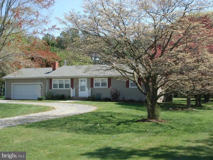 212 Ewingtown Road Church Hill, MD 21623 - Photo 1 of 10 a front view of a house with a garden