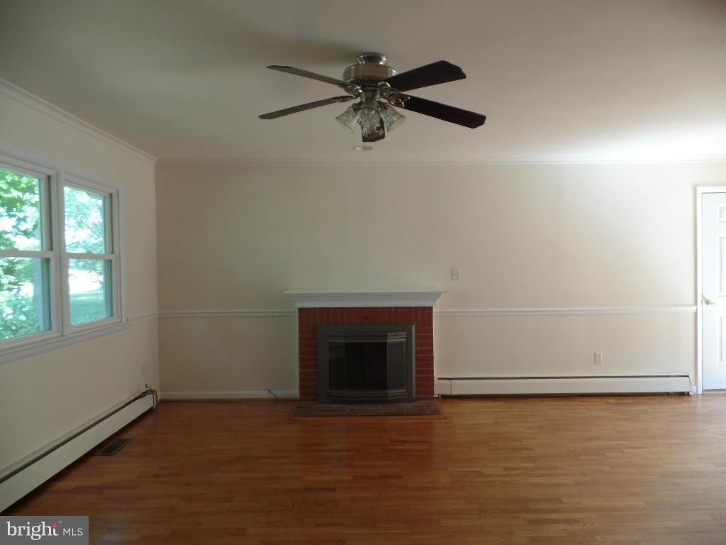 212 Ewingtown Road Church Hill, MD 21623 - Photo 3 of 10 an empty room with a empty space and windows