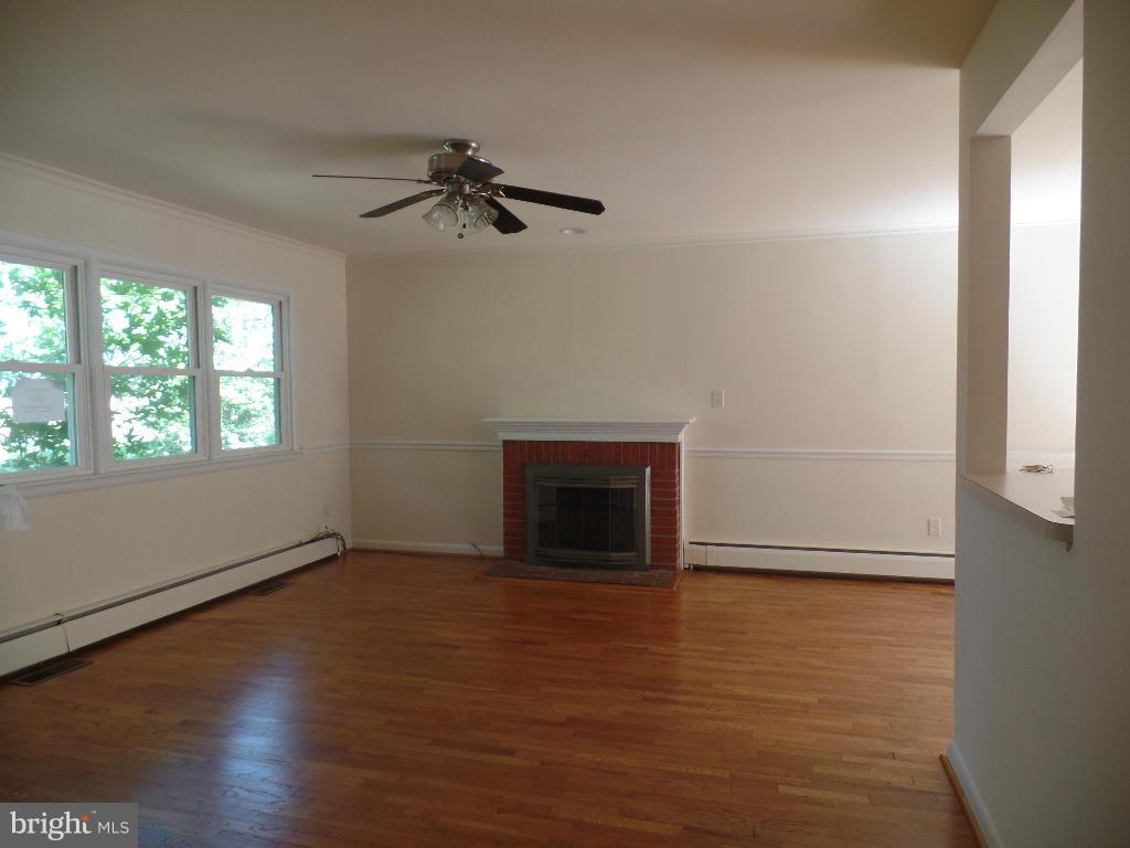 212 Ewingtown Road Church Hill, MD 21623 - Photo 5 of 10 a view of empty room with wooden floor and fan