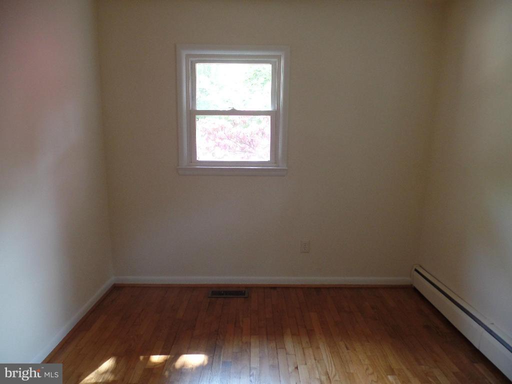 212 Ewingtown Road Church Hill, MD 21623 - Photo 8 of 10 a view of a small space with wooden floor and a window