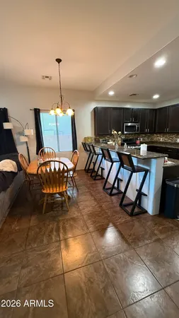 a kitchen with stainless steel appliances granite countertop a sink counter space and cabinets