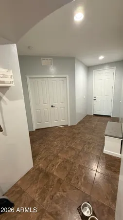 a living room with lots of furniture and kitchen view