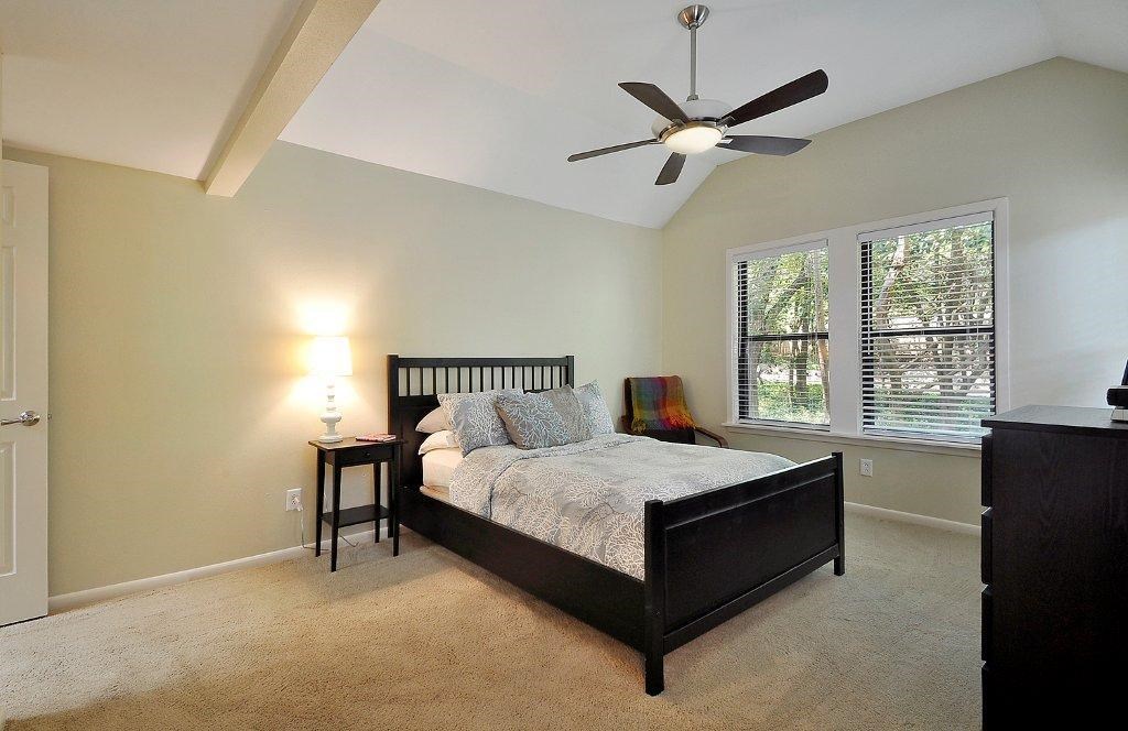 735 Patterson Avenue Austin, TX 78703 - Photo 13 of 15 a bedroom with a bed and window