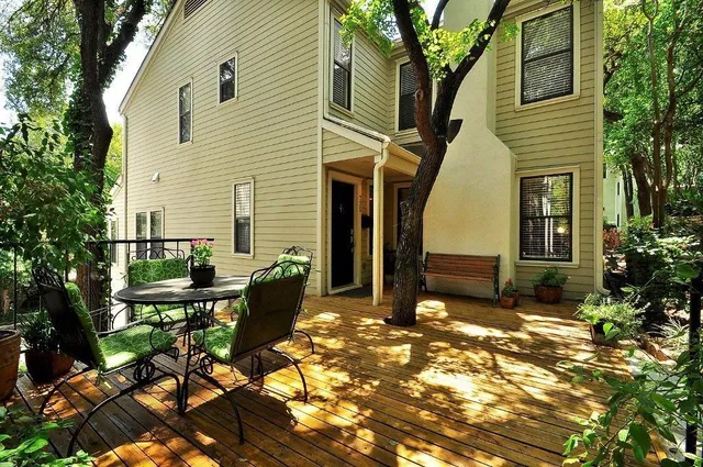 a view of a house with backyard porch and sitting area