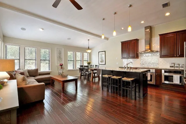 a large kitchen with a table and chairs