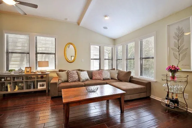 a living room with furniture and a large window